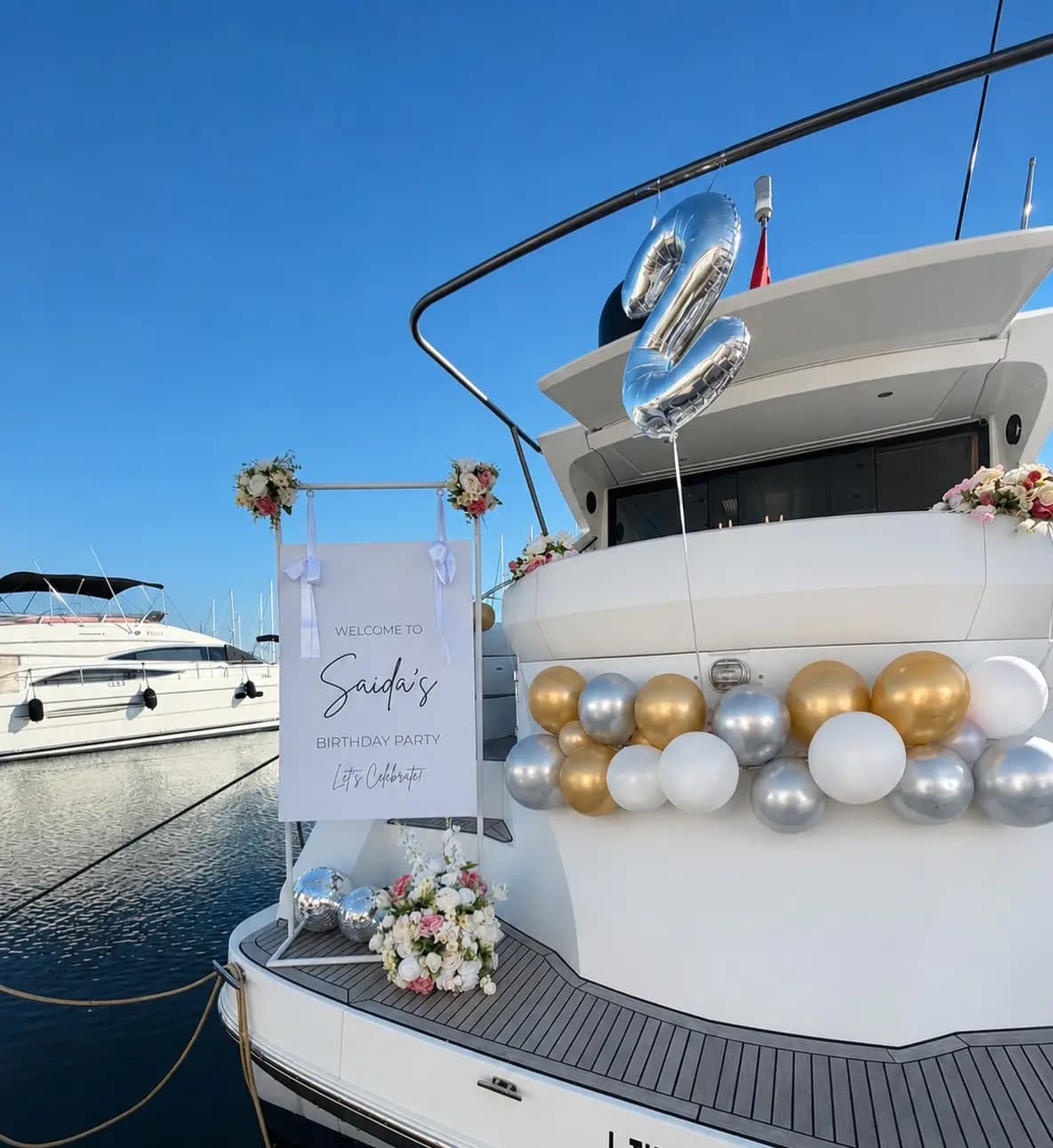Yacht decoration in Dubai — balloon and floral party setup on deck