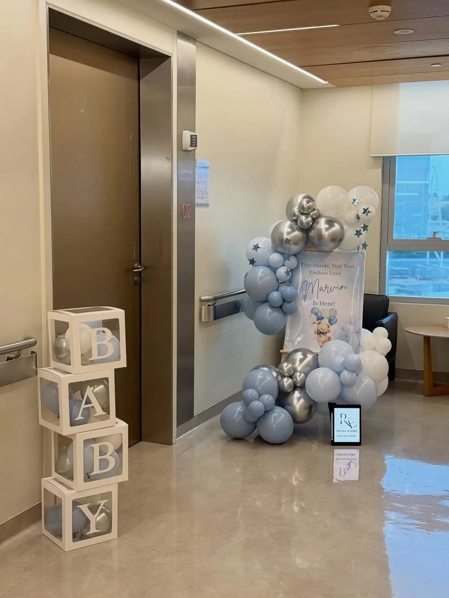 Hospital newborn decoration with pastel balloons and welcome baby setup