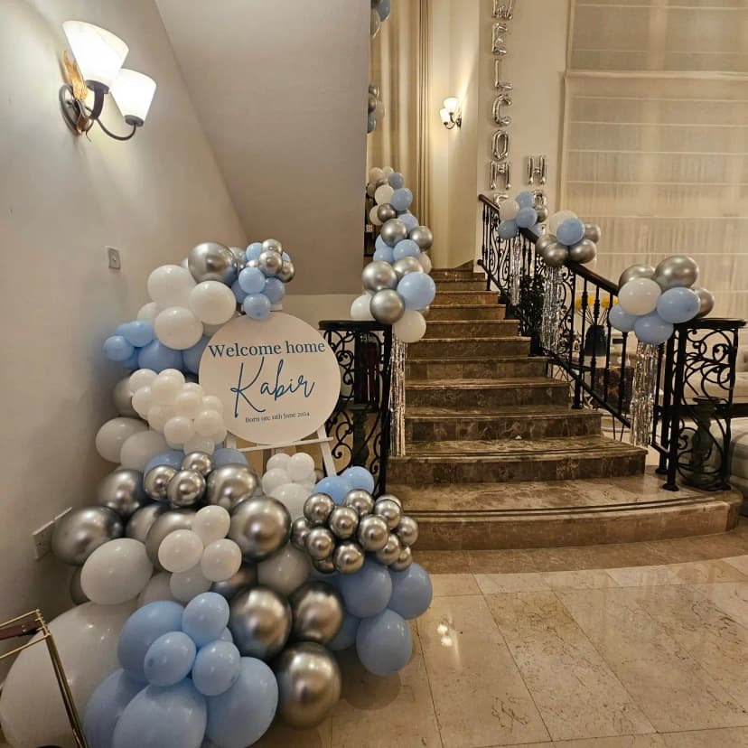 Elegant baby welcome decoration with pastel balloons and soft theme
